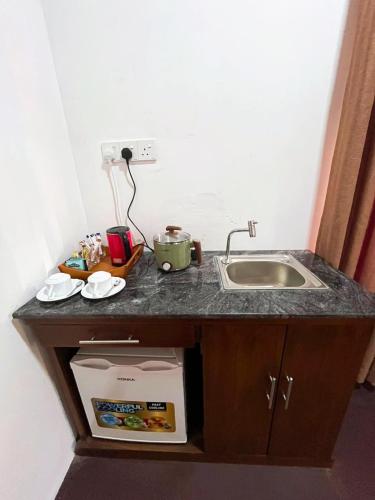 a kitchen counter top with a sink and a sink at Villa Mistica - Hiriketiya Dikwella in Dickwella