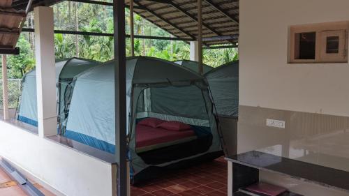 a room with a tent in a building at Thota'dha Tent Stay in SanivÄrsante