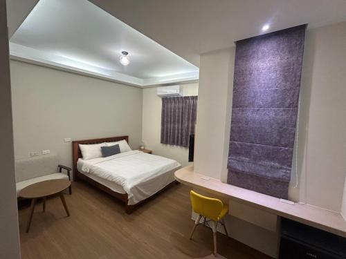 a bedroom with a bed and a large window at Shower & Sleep in Huxi