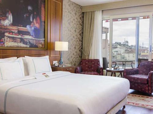 En eller flere senge i et værelse på Neorion Hotel - Special Class