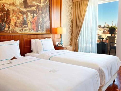 two white beds in a hotel room at Neorion Hotel - Special Class in Istanbul