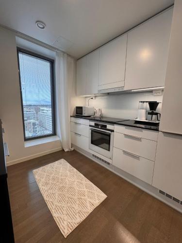 Foto Kotimaailma Apartments - Upea yläkerroksen studio - Itsenäisyydenkatu 4