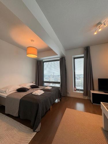 Foto Kotimaailma Apartments - Upea yläkerroksen studio - Itsenäisyydenkatu 1