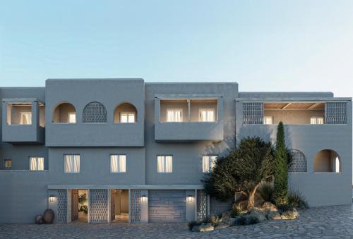 a large gray building with a lot of windows at Meros, Santikos Collection in Naousa