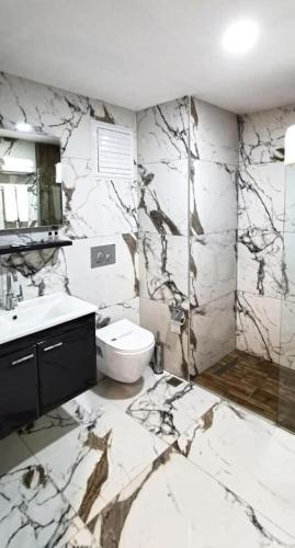 a bathroom with a toilet and a sink at Mes Hotel & Spa in Samsun