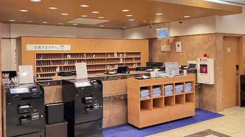 a store with two refrigerators and a counter at Toyoko Inn Hakata Nishi-nakasu in Fukuoka