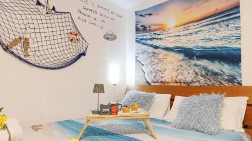 a bedroom with a bed and a table at Alicetta Apartment by Ca-Sa Check in Chioggia