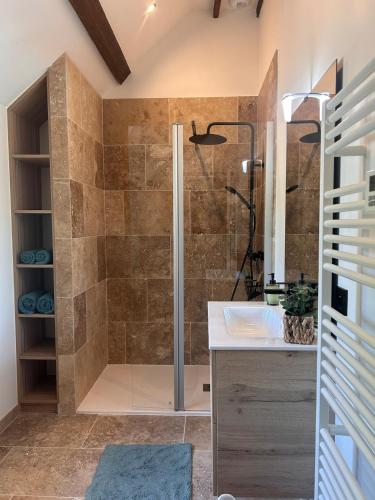 a bathroom with a shower and a sink at Le Chêne Guesthouse in Aunou-sur-Orne