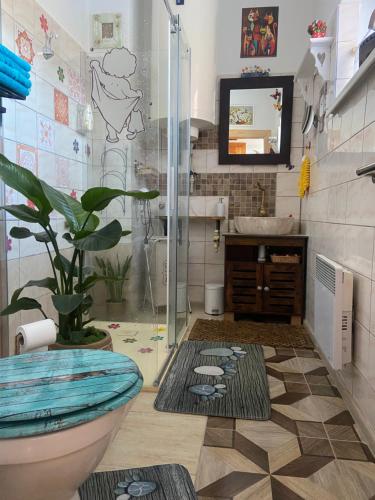 a bathroom with a shower and a toilet and a sink at Luxusný apartmán u Loly in Polomka