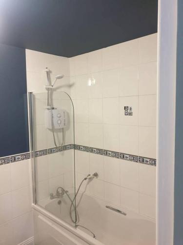 a bathroom with a shower and a bath tub at 3Br Apartment - Sleeps 7 - Free Parking - Athy in Athy