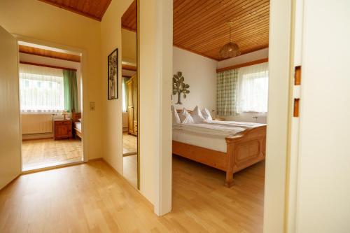 a bedroom with a large bed in a room at Winzerhaus am Eichberg in Leutschach