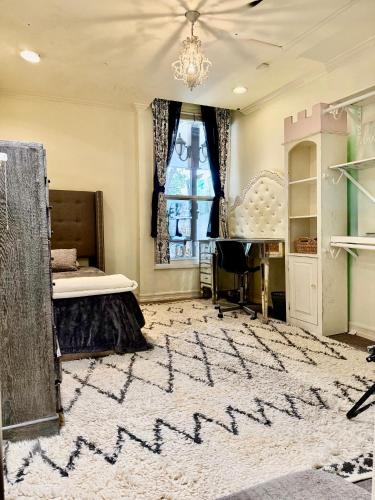 a bedroom with a bed and a chandelier at Private Room View Gated 2Acre Estate - Female Share Indoor - Men Share Outdoor - SD in Encino