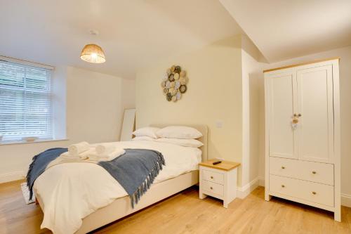 a bedroom with a bed with white sheets and pillows at Apt 1 Armatage Flats, Eyemouth in Eyemouth