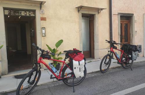 two bikes parked on the side of a building at Torre Cà Emo - Monolocale "L'Antico portico" in Vittorio Veneto