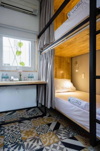 Postel nebo postele na pokoji v ubytování Ccasa Hostel