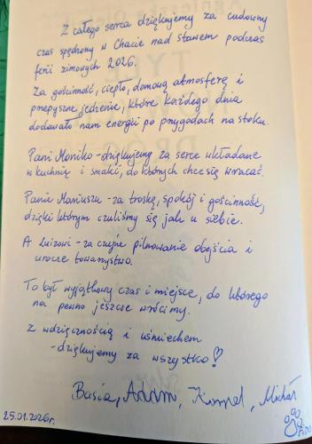 a letter written in blue ink on a white paper at Chata nad stawem in Wierchomla Mała