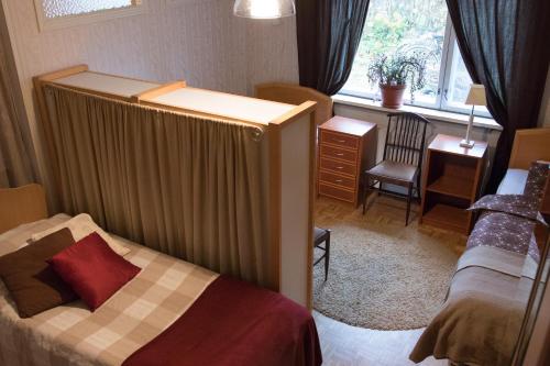 Postel nebo postele na pokoji v ubytování Gasthaus Mikkeli