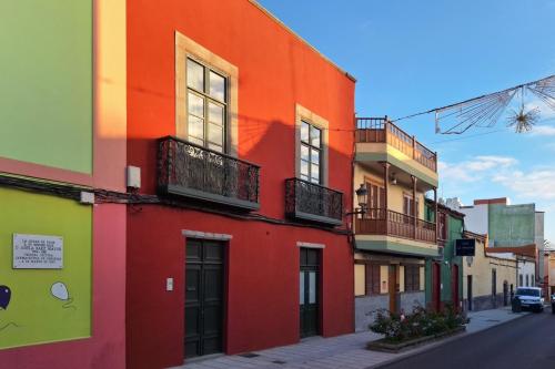 a colorful building on the side of a street at Casa Langlois in Telde