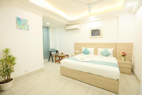 a bedroom with a large bed in a room at CORPORATE STAYS-Golf Course Road in Gurgaon