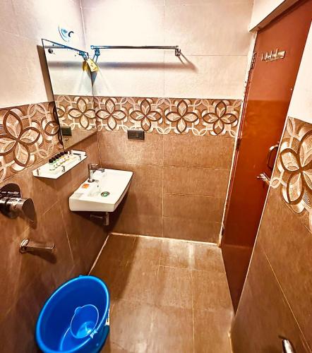 a bathroom with a sink and a toilet at Hotel Windsor Plaza in Hyderabad
