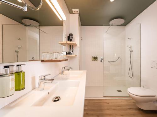 a bathroom with a sink and a toilet and a shower at ARTIEM Capri in Mahón