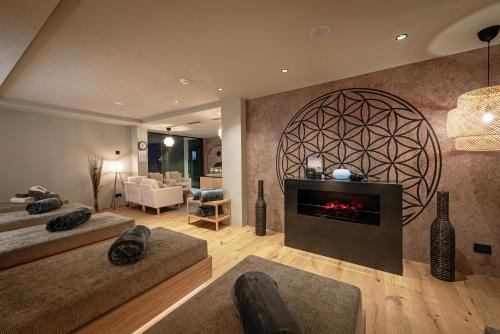 a living room with a fireplace and a couch at Residence Angelika in Corvara in Badia
