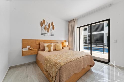 a bedroom with a bed and a large window at New-Promo-2 Queen Beds-Near Beach-Poolside-Sleep 6 in Mazatlán