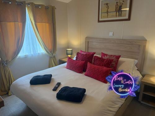 a bed with a sign that says happy new year at Goaty Lodge - 2 The Green in Tattershall