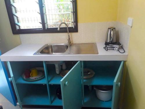 Una cocina o kitchenette en Tigo Inn