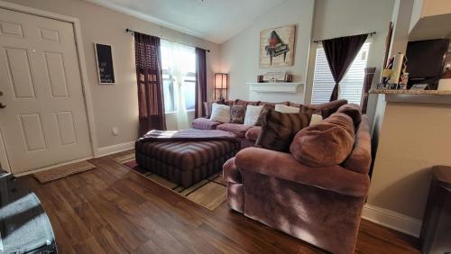 a living room with a couch and a chair at Cozy 2 Bedroom Townhome in Addison in Addison