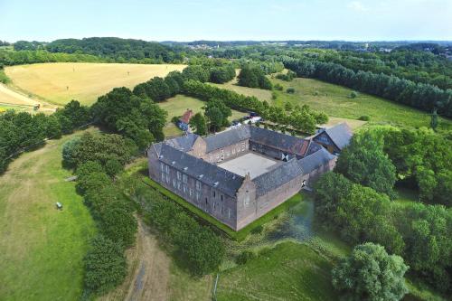 an aerial view of an old building in a field at Kasteelhotel Terborgh, BW Signature Collection in Schinnen