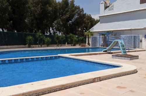 Charming 3-Bedroom House with Shared Pool in Punta Prima, Torrevieja