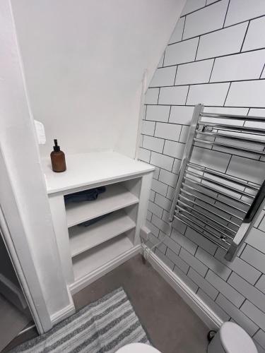 a bathroom with a sink and a toilet at Foretop Cottage, Staithes in Staithes