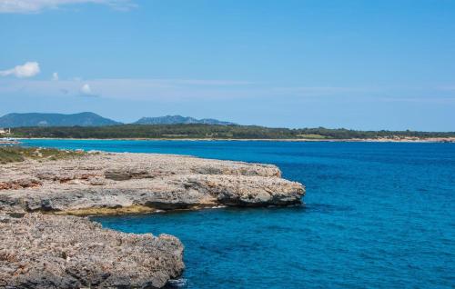 a large body of water with rocks in the water at Cielo Mar in S'Illot
