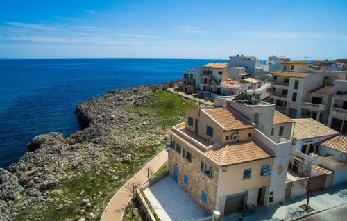 an aerial view of a group of buildings next to the ocean at Cielo Mar in S'Illot