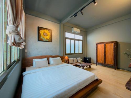 a bedroom with a large bed in a room at Sita Home in Danang