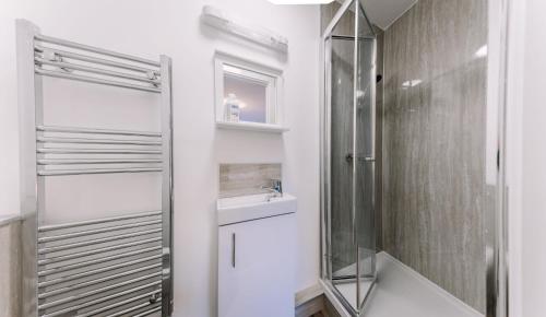 a bathroom with a shower and a sink at Endsleigh Park Hotel in Hull