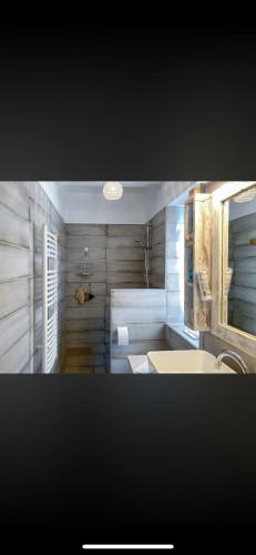 a bathroom with a sink and a mirror at Henye holiday homes in Balatonhenye
