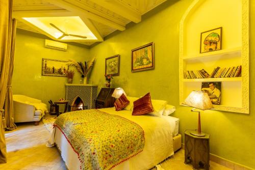 a bedroom with a bed and a living room at Riad Habouba in Marrakesh