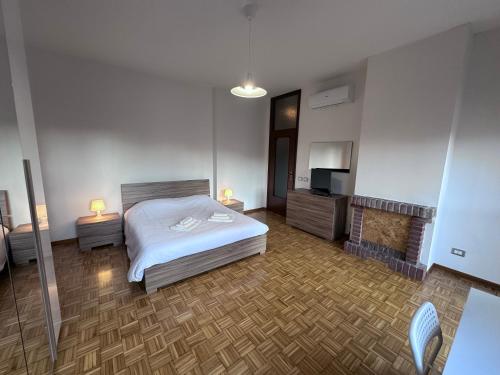 a bedroom with a bed and a fireplace at Hospital - WI-FI 3 Bedrs in Reggio Emilia