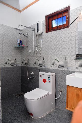 a bathroom with a toilet and a sink at AERO View Villa in Induruwa