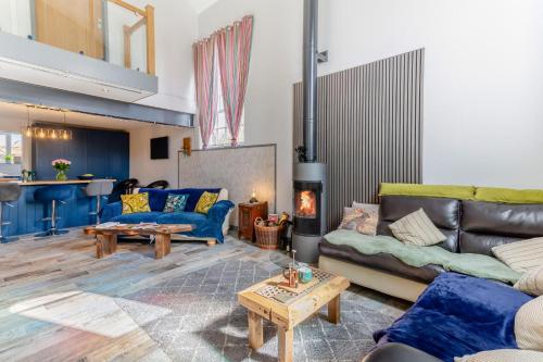 a living room with couches and a fire place at 3 Bed in Crowle oc-s30617 in Crowle