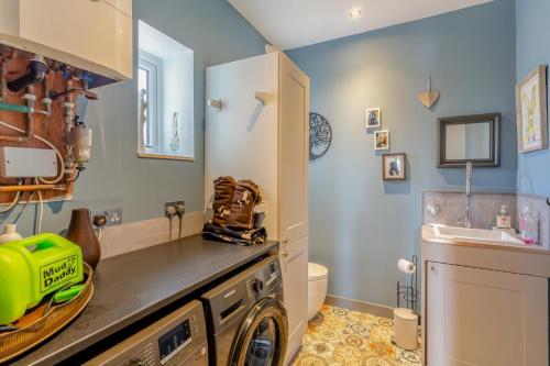 a kitchen with a washing machine and a sink at 3 Bed in Crowle oc-s30617 in Crowle