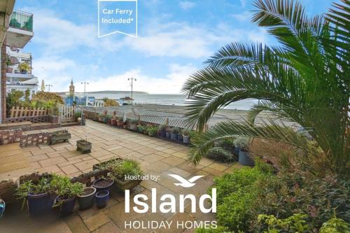 a sign that reads island holiday homes with a view of the beach at Shanklin Beach - Napier in Shanklin