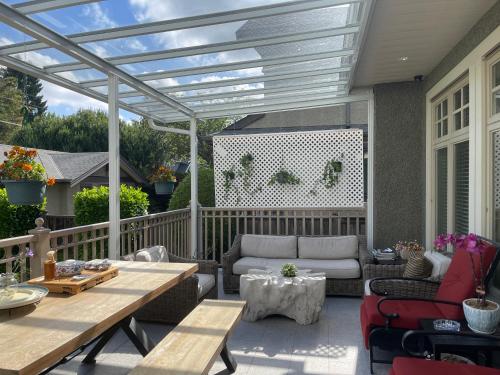 a patio with a pergola and a table at Campus Haven in Vancouver