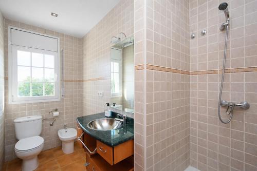a bathroom with a sink and a toilet at Catalunya Casas Tranquil Costa Brava Retreat with private suite! in Sils