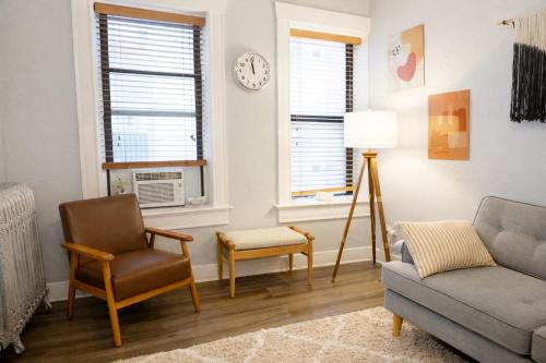 a living room with a couch and a chair at Downtown Gem • King Bed • Fast WIFI in Salt Lake City