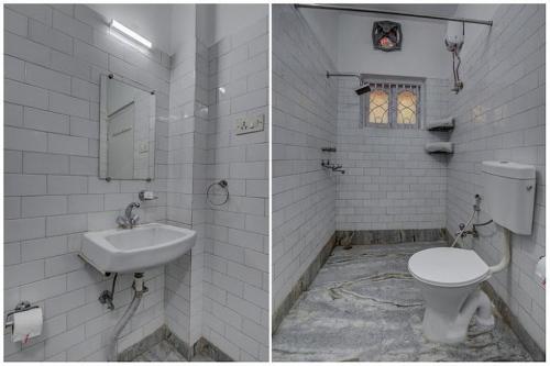 a white bathroom with a sink and a toilet at ADRIJA Ck 140 Saltlake SEC-ll in kolkata