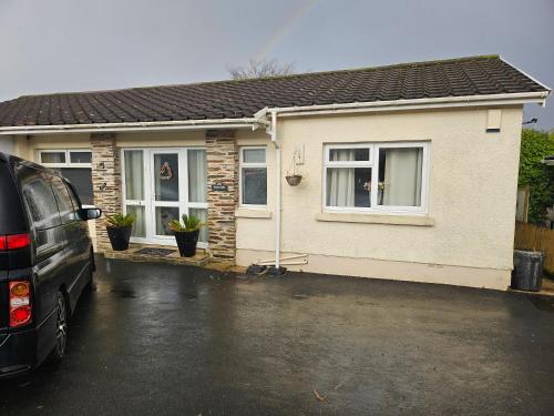 a van parked in front of a house at Shalom, in Saundersfoot, near the sea in Saundersfoot