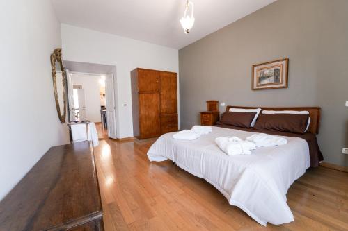 a bedroom with a large bed with towels on it at La terrazza nel tempo in Fiuggi